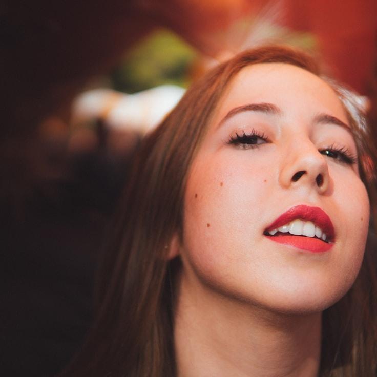 Kaveri Mehta, Lead Design Curator at Novel Harbor Press, reviewing corporate floral arrangements